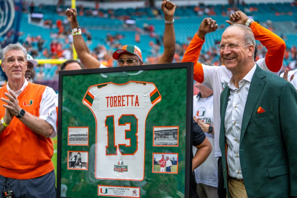 Heisman Trophy-winning former University of Miami quarterback Gino Torretta is honored with a jersey retirement at halftime of Miami’s game versus Louisville at Hard Rock Stadium on Nov. 18, 2023.