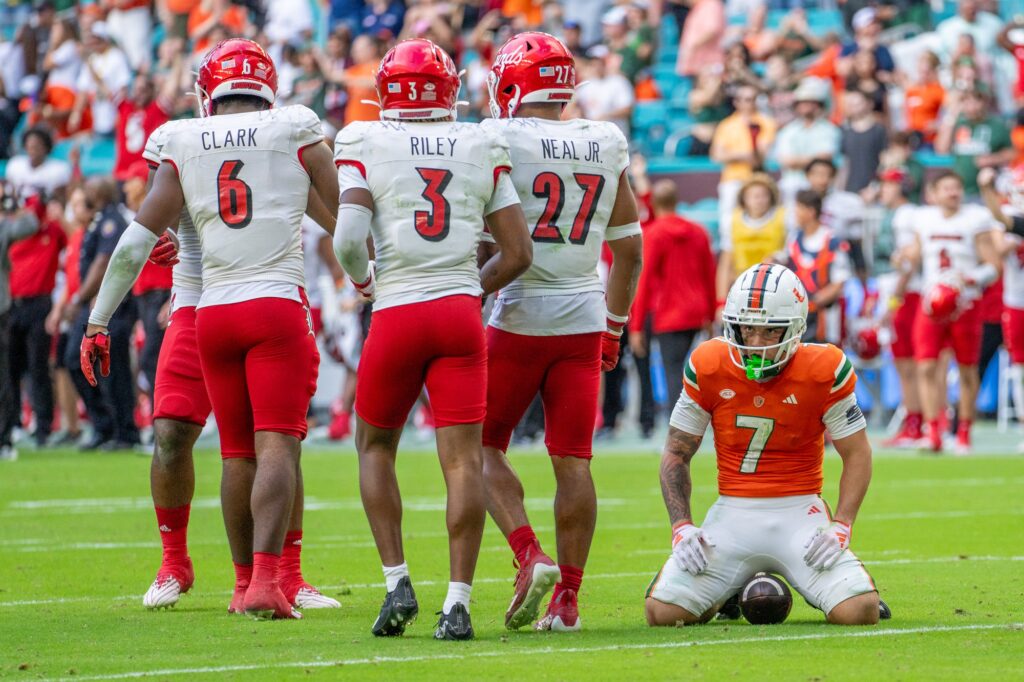 Fourth-year junior wide receiver Xavier Restrepo takes a moment after being tackled short of the end zone in what would have been the game-tying touchdown in the final moment fourth quarter of Miami’s game versus Louisville at Hard Rock Stadium on Nov. 18, 2023.