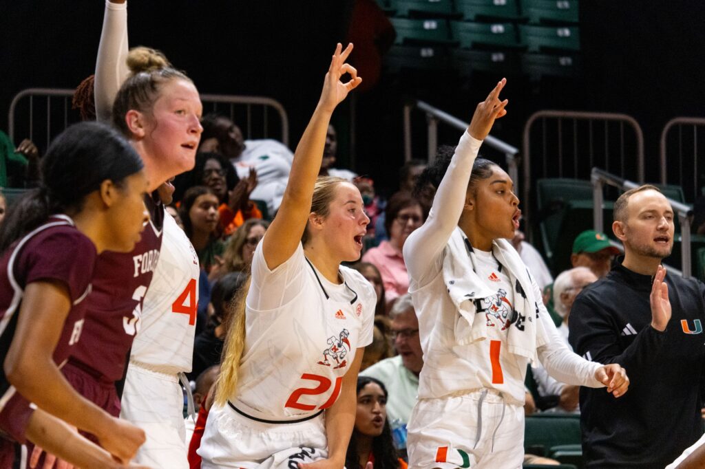 After graduate student Jaida Patrick makes her second three-pointer of the game against Fordham University, Miami's bench erupts in cheers during the 78-39 win in the Watsco Center.