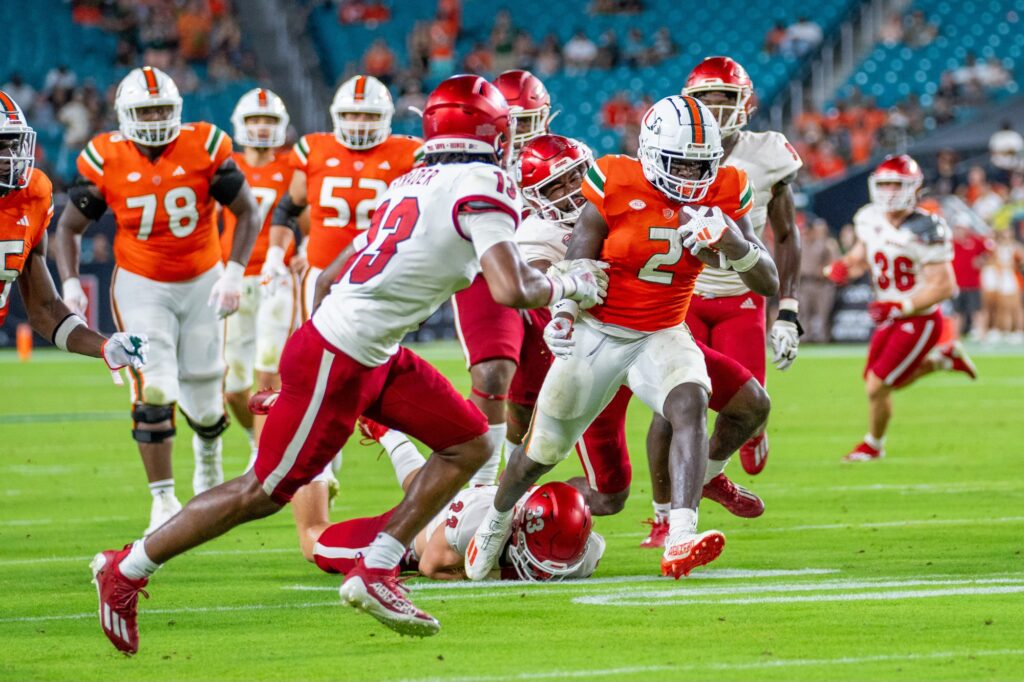 Fourth-year redshirt sophomore running back Donald Chaney, Jr. evades tacklers during his 20-yard rushing touchdown in the fourth quarter of Miami’s game versus Miami (OH) at Hard Rock Stadium on Sept. 1, 2023.