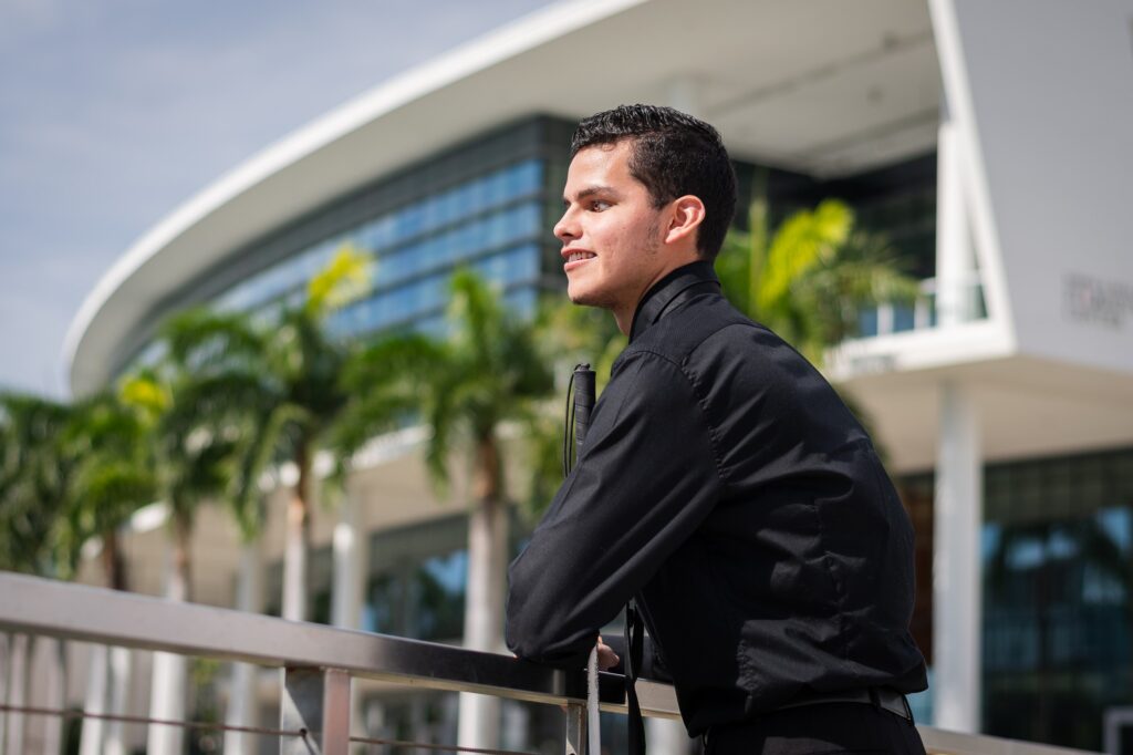 Sophomore vocal performance major Silvio Plata stands in front of the Shalala Student Center on Dec. 4, 2023.