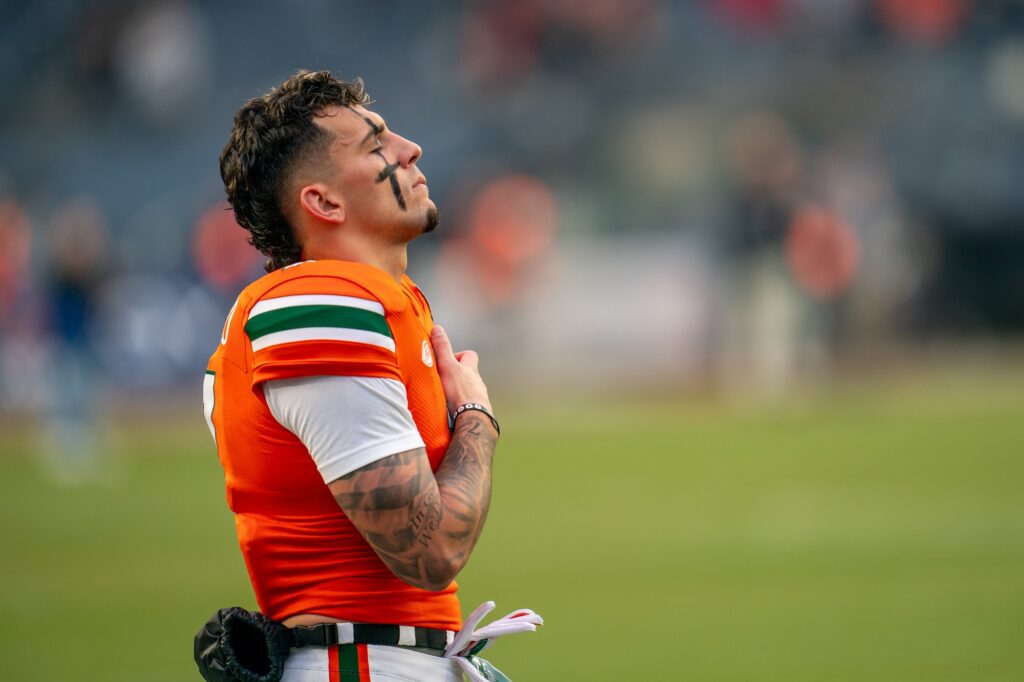 Fourth-year junior wide receiver Xavier Restrepo stands for the national anthem head of Miami’s Pinstripe Bowl Matchup versus Rutgers at Yankee Stadium on Dec. 28, 2023.