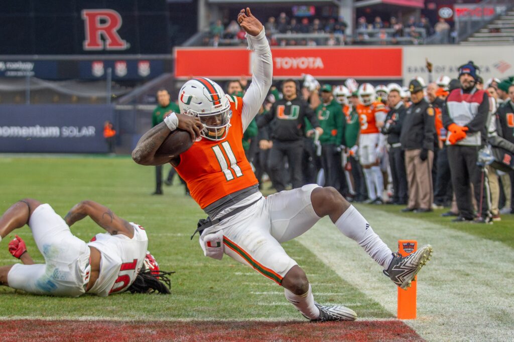Sophomore quarterback Jacurri Brown slides into the end zone for a touchdown in the second quarter of Miami’s Pinstripe Bowl Matchup versus Rutgers at Yankee Stadium on Dec. 28, 2023.