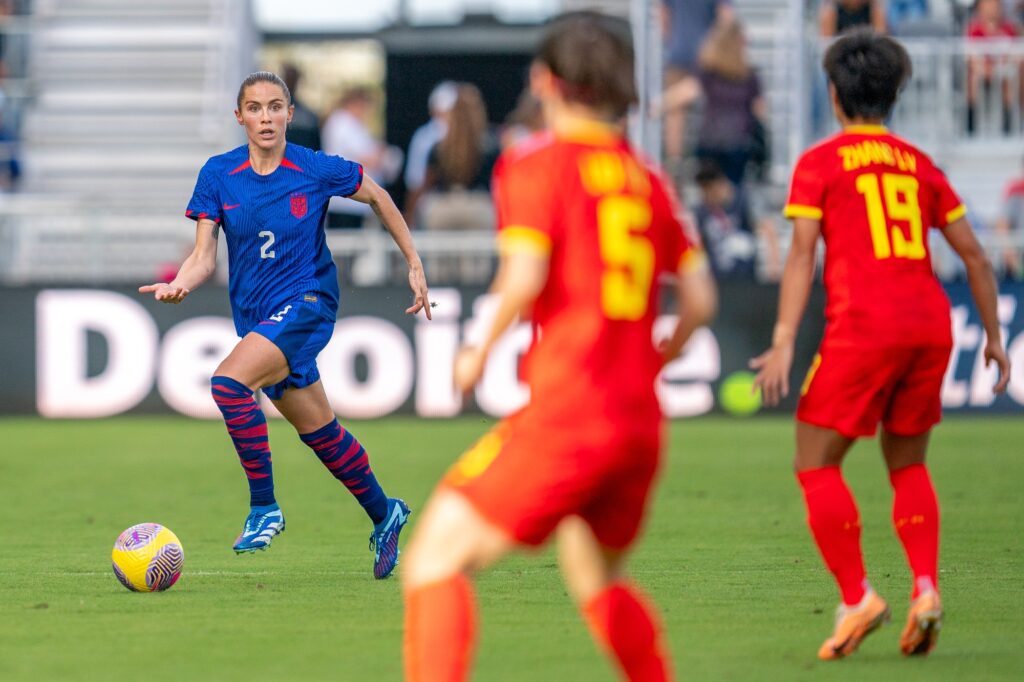 Defender Abby Dahlkemper dribbles downfield in the first half of the USWNT match versus China PR at DRV PNK Stadium on Dec. 2, 2023.