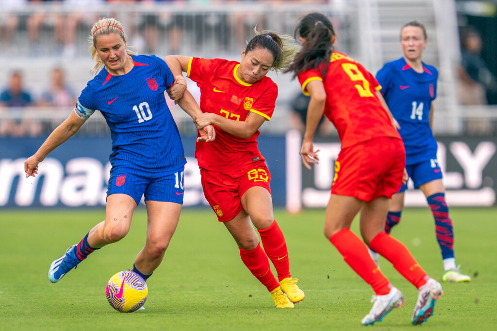 Midfielder Lindsey Horan fights for possession in the first half of the USWNT match versus China PR at DRV PNK Stadium on Dec. 2, 2023.