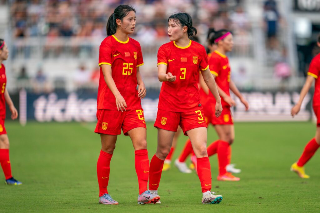 Defenders Wang Siqian and Don Jiaxing discuss strategy in the first half of the USWNT match versus China PR at DRV PNK Stadium on Dec. 2, 2023.