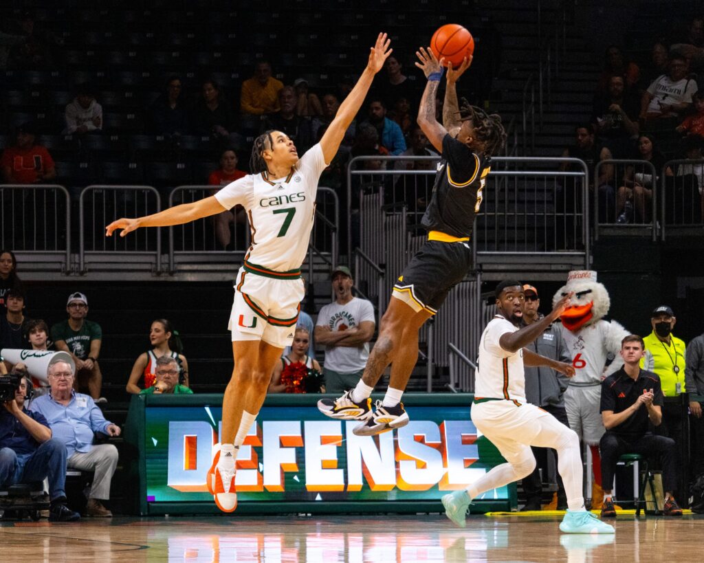 During the winter break game against La Salle, freshman Kyshawn George contests a shot by guard Khalil Brantley in the first half of the 84-77 win at the Watsco Center.