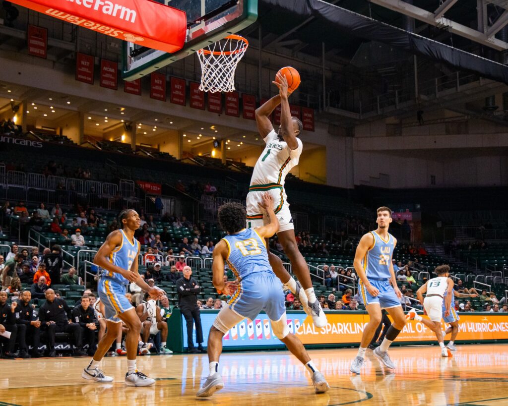 Freshman Michael Nwoko slams down a dunk in the second half of the blowout win against LIU in the Watsco Center.