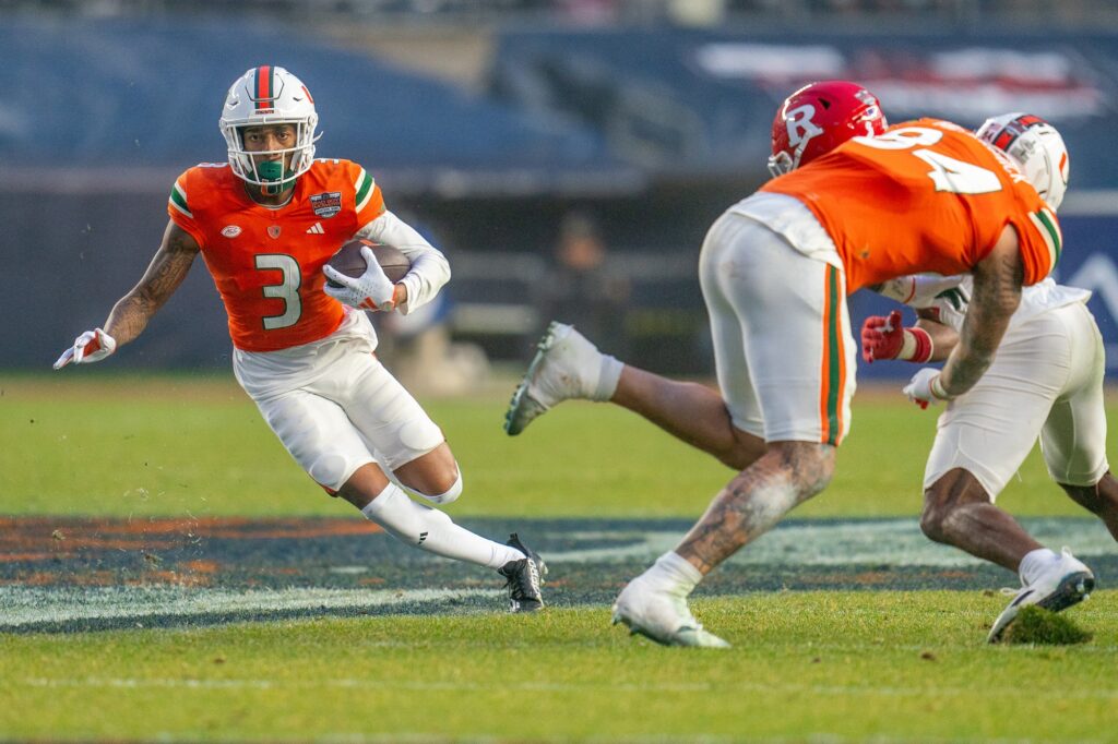 Junior wide receiver Jacolby George evades defenders in the third quarter of Miami’s Pinstripe Bowl Matchup versus Rutgers at Yankee Stadium on Dec. 28, 2023.