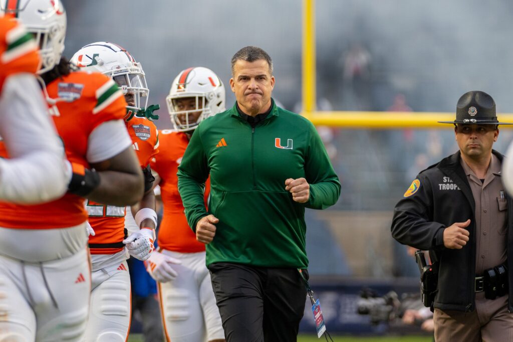 The Hurricanes take the field ahead of their Pinstripe Bowl matchup versus Rutgers at Yankee Stadium on Dec. 28, 2023.