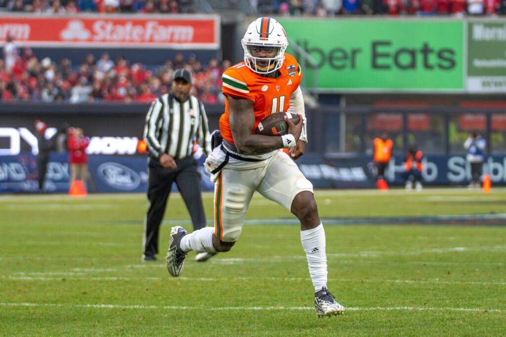 Sophomore quarterback Jacurri Brown rushes to the end zone for a touchdown in the second quarter of Miami’s Pinstripe Bowl Matchup versus Rutgers at Yankee Stadium on Dec. 28, 2023.