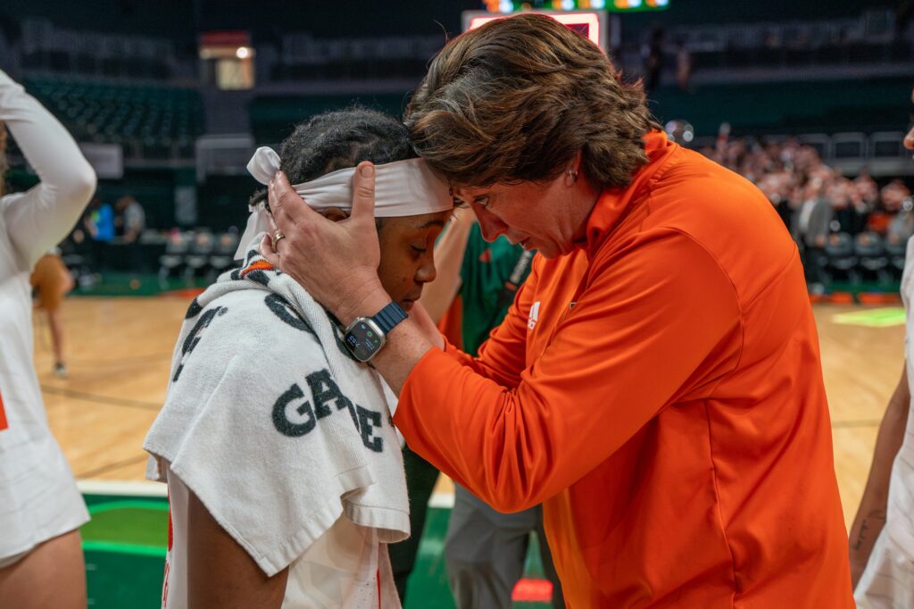 Head coach Katie Meier takes a moment with junior guard Lashae Dwyer after Miami’s 73-59 win over versus NC State in the Watsco Center on Jan. 18, 2023.