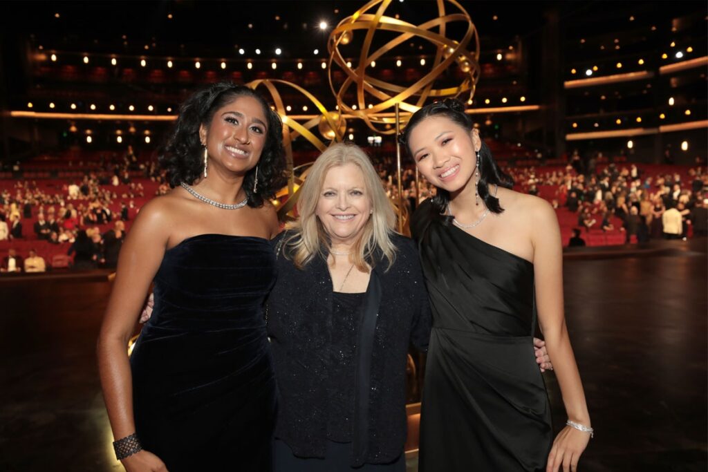 Television Academy interns and Bob Bennett Future Leaders Geethika Kataru (left) and Carissa Liu (right) served as trophy presenters at the 75th Emmy Awards pictured with philanthropist Kelly Bennett (center) before the telecast on Jan. 15, 2024 at the Peacock Theater at LA Live.