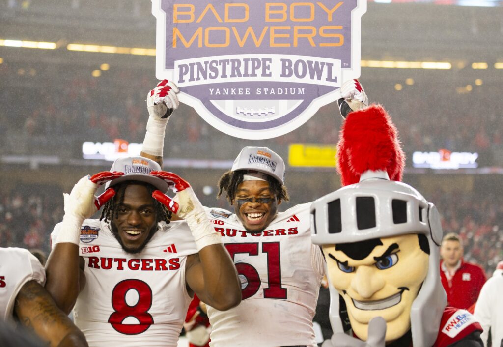 Rutgers players and mascot celebrate after their Pinstripe Bowl win against Miami at Yankee Stadium on Dec. 28, 2023.