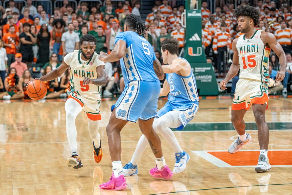 Junior guard Wooga Poplar dribbles down court in the final seconds of Miami's game versus the University of North Carolina in the Watsco Center on Feb. 10, 2024.