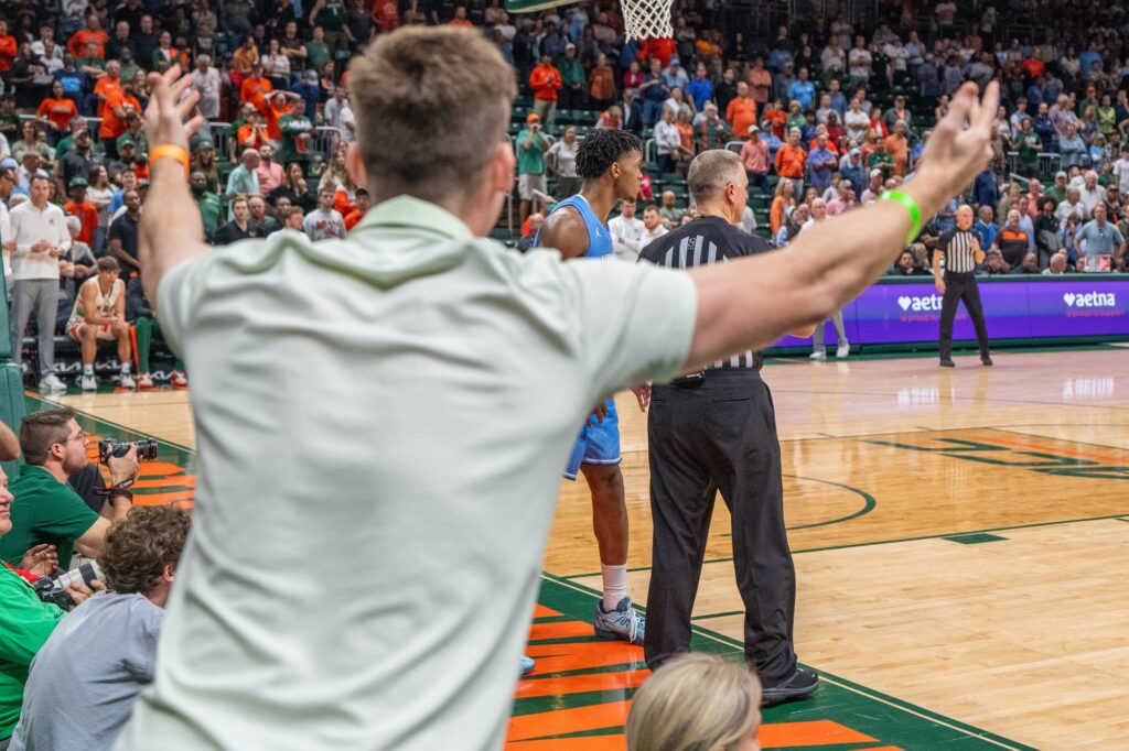 A fan disagrees with a referee in the final seconds of Miami's 72-75 loss to the University of North Carolina in the Watsco Center on Feb. 10, 2024.