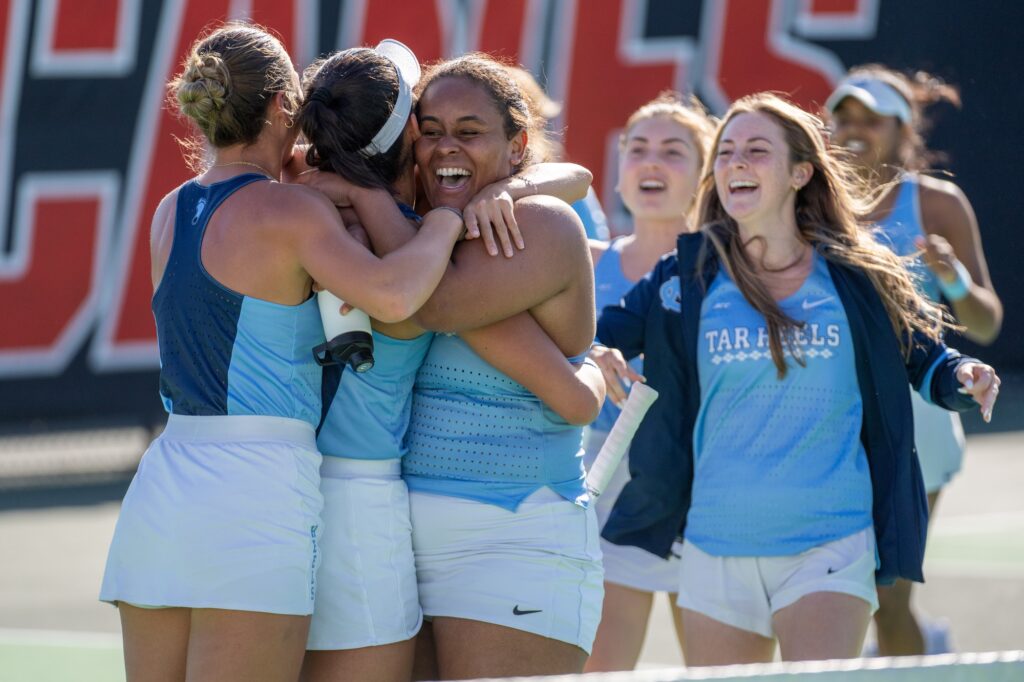 University of North Carolina players celebrate following their win over Miami at the Neil Schiff Tennis Center on Feb. 25, 2024.