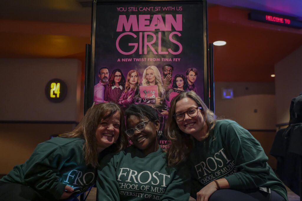 Attendees wear the Frost School of Music sweatshirt featured in the "Mean Girls" movie at the Cosford Cinema screening on Wed, Feb. 7.