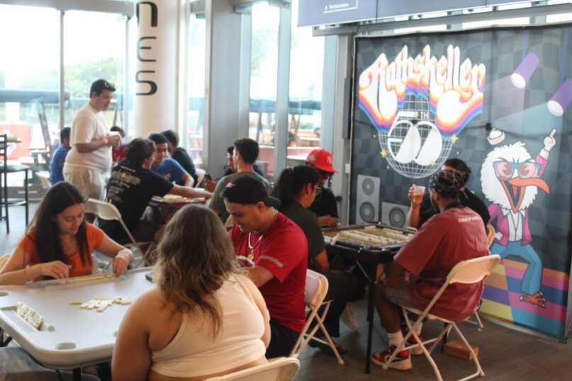 Students gather at The Rathskeller to play in the annual FEC Week of Cuban Culture Domino Tournament. Photo Courtesy of FEC.