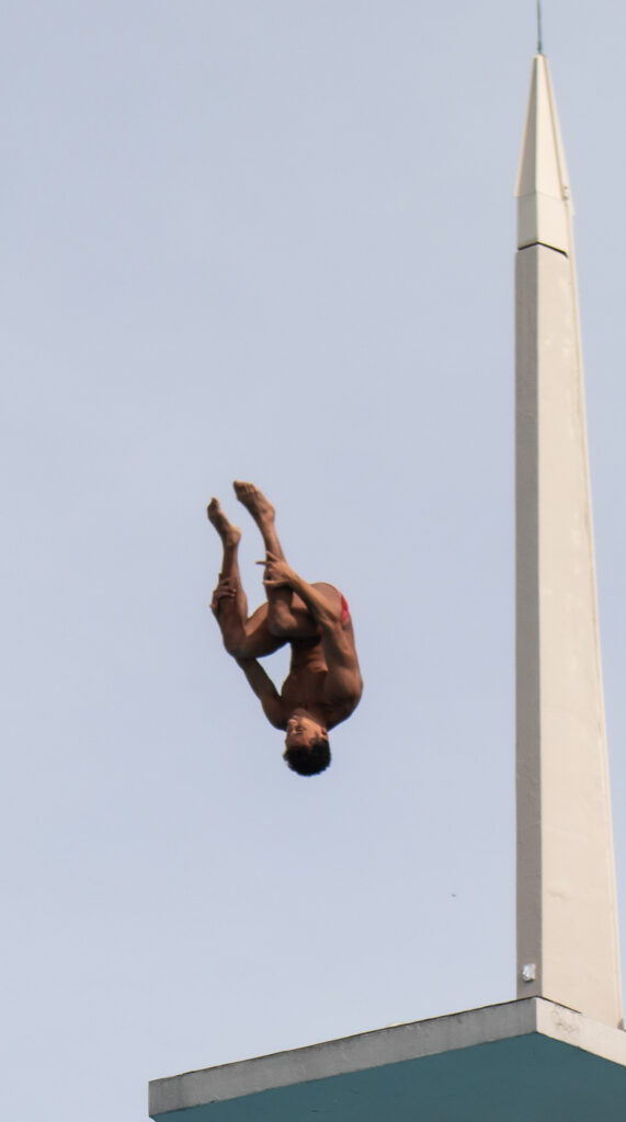 University of Miami Sophomore diver Mohammed Farouk flips off the high dive at the University Center Pool on Friday, Feb. 16, 2024.