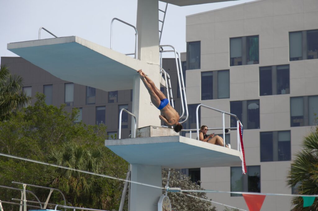 Miami diver performs a dive during the First Chance Meet at the Whitten Center Pool on Feb. 16, 2024.