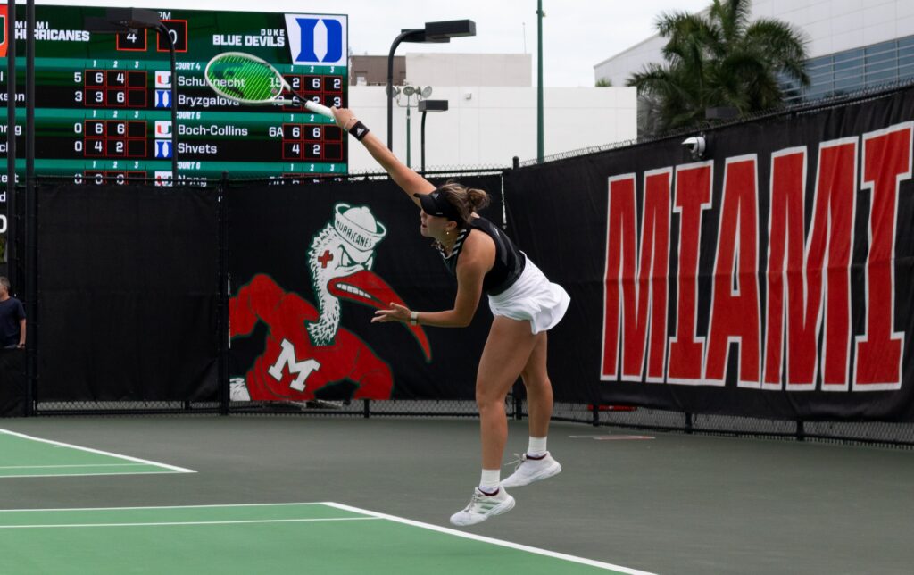Miami junior Alexa Noel serves the ball to her Duke opponent on Friday, Feb. 23, 2024.
