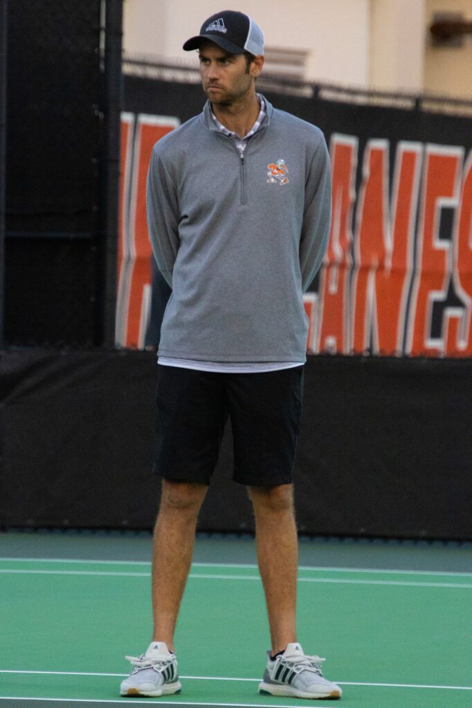 Head Coach Aljosa Piric watches his players against UTSA at the Neil Schiff Tennis Center on Friday, Feb. 23, 2024.