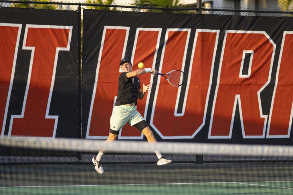 Graduate student Vladislav Melnic hits a forehand during his singles match against UTSA's Alan Magadan at the Neil Schiff Tennis Center on Feb. 23, 2024.