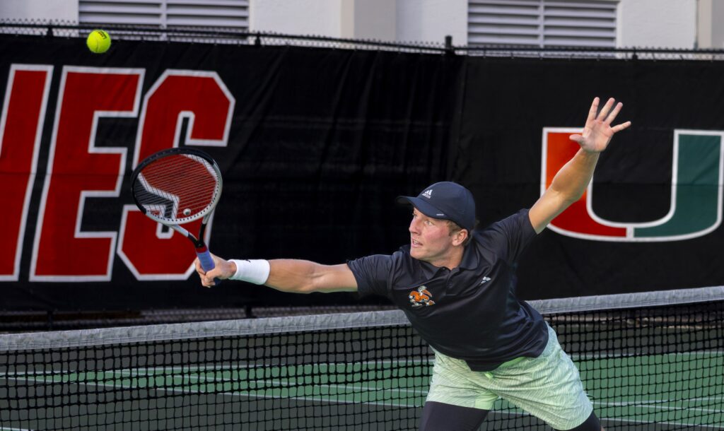 Senior Adrian Burdet makes a leaping backhand return at the Schiff Tennis Center on Feb. 23, 2024.