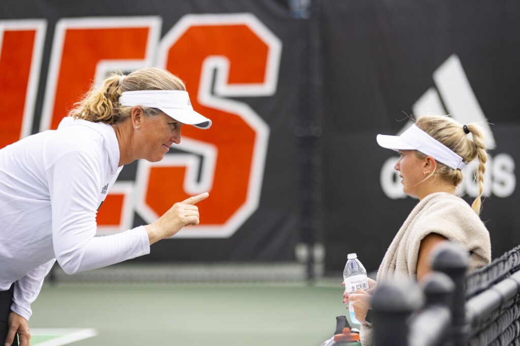 Head Coach Paige Yaroshuk-Tews speaks to fifth-year senior Antonia Balzert in between games during her match against Duke University's Katie Codd at the Neil Schiff Tennis Center on Feb. 23, 2024.