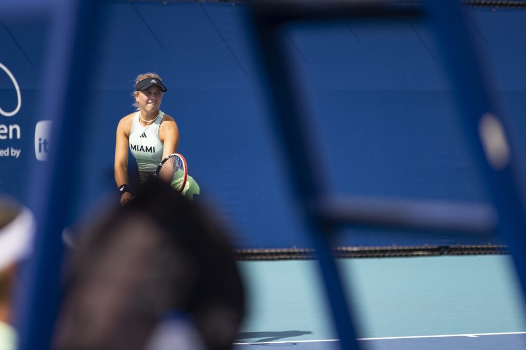 Fifth-year senior Antonia Balzert looks up before serving during her doubles match with partner Leonie Schuknecht against Boston College at the Miami Open at Hard Rock Stadium on March 29, 2024.