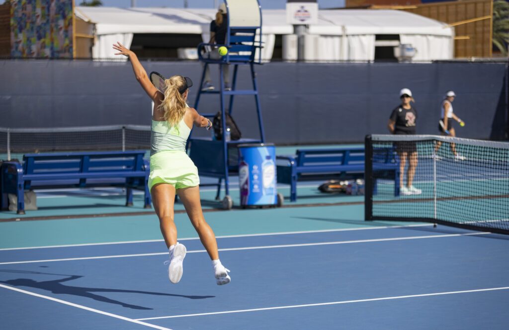 Senior Isabella Pfennig leaps to grab a volley during her singles match against Boston College's Natalie Eordekian at the Miami Open at Hard Rock Stadium on March 29, 2024.