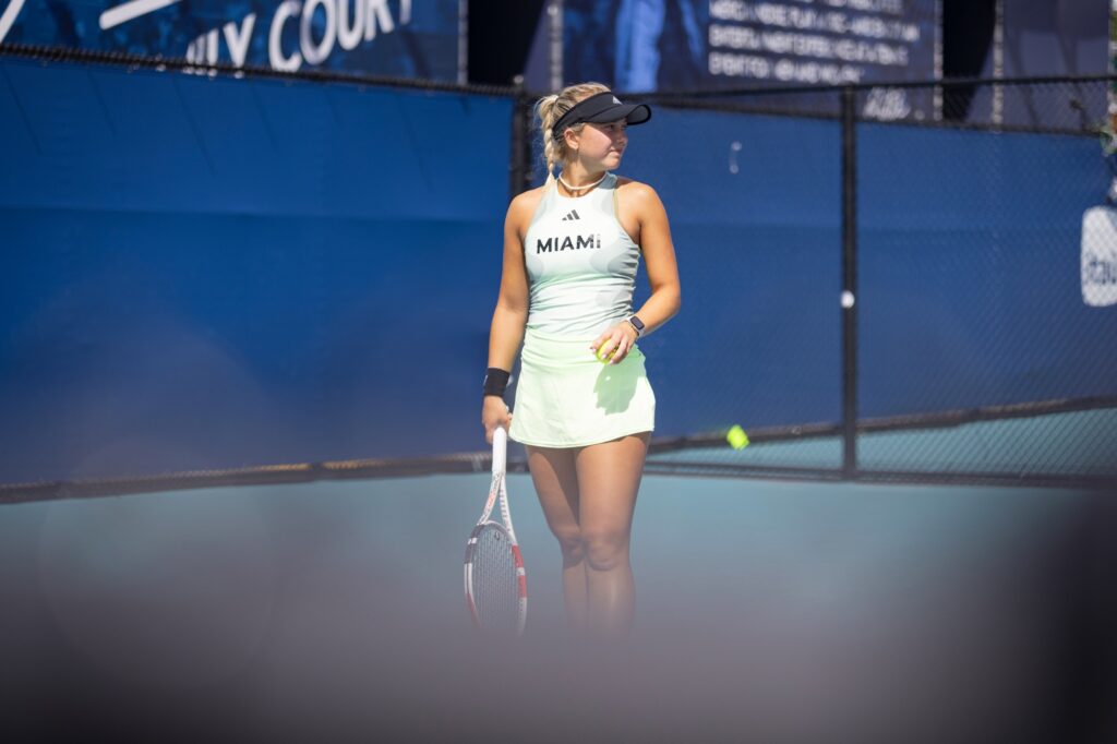 Fifth-year senior Antonia Balzert glances at her opponent before serving during her doubles match with partner Leonie Schuknecht against Boston College at the Miami Open at Hard Rock Stadium on March 29, 2024.